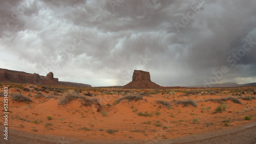 The Monument Valley Navajo Tribal Park in Arizona, USA. View of a storm over the West Mitten Butte, East Mitten Butte, Merrick Butte, Mitchel Butte, Sentinel Mesa Monuments.