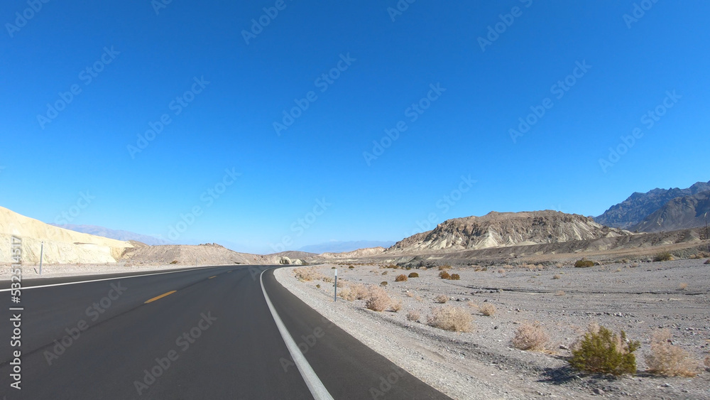 Drive through Death Valley National Park in California, USA. Desert road in Death Valley. Drive through Death Valley National Park in California, USA. Desert road in Death Valley.