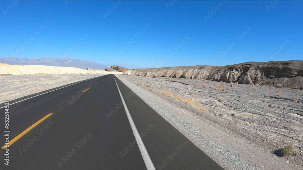 Drive through Death Valley National Park in California, USA. Desert road in Death Valley. Drive through Death Valley National Park in California, USA. Desert road in Death Valley.