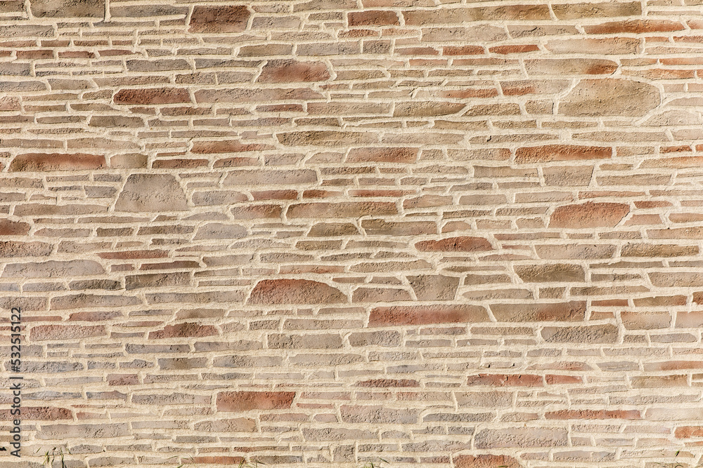 Vieux mur d'une maison en pierre avec joint.