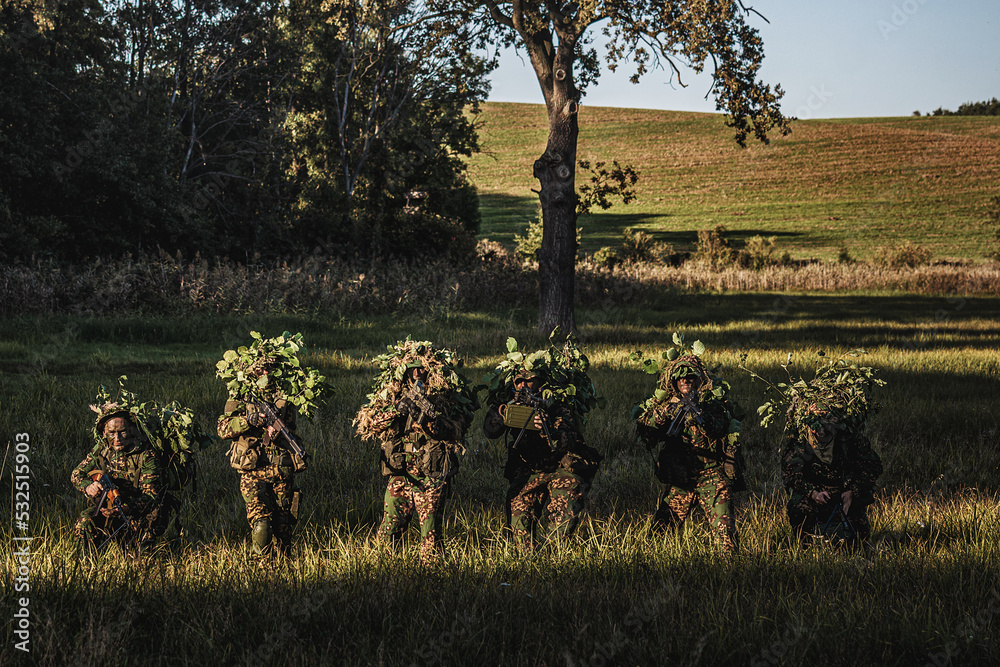Eastern special forces soldiers with rifle in woodland Stock Photo ...