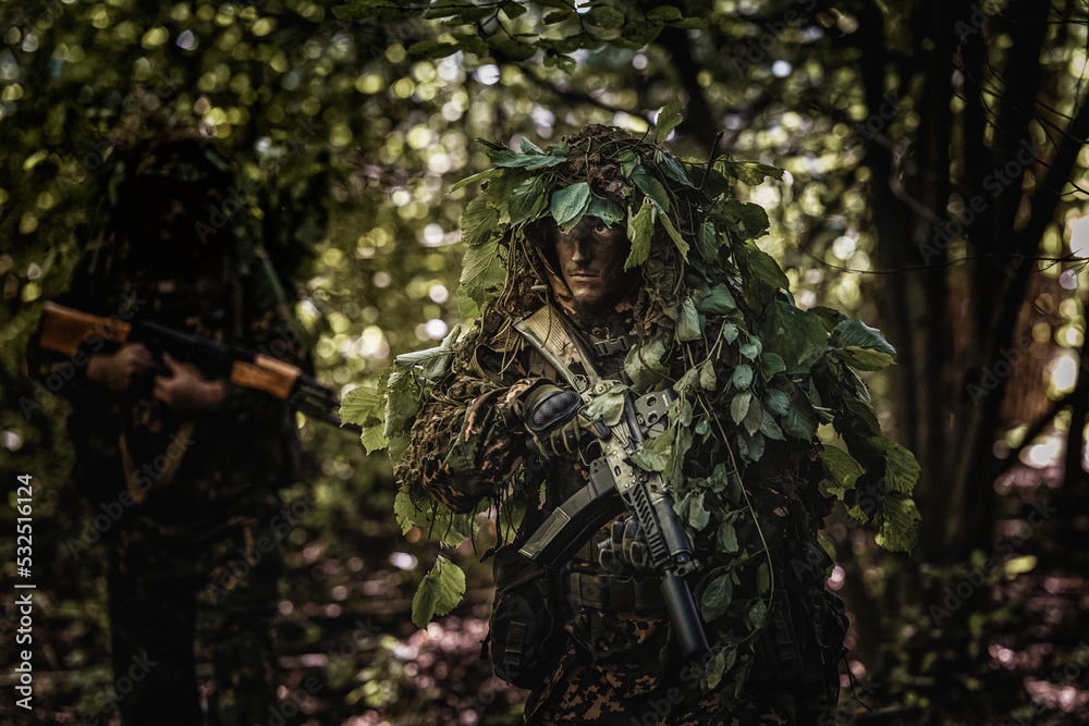 Eastern special forces soldier with rifle in woodland Stock Photo ...
