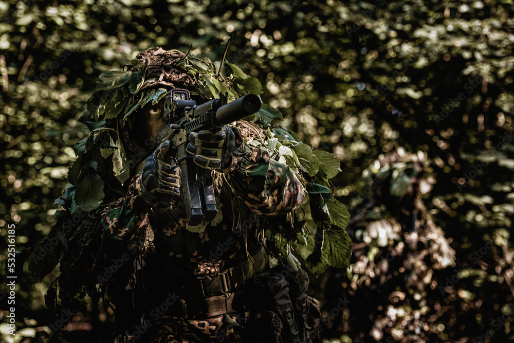 Eastern special forces soldier with rifle in woodland Stock Photo ...