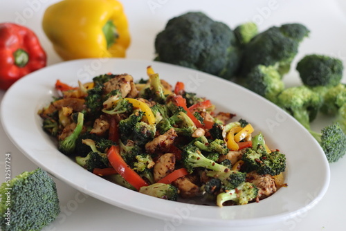 Stir fried vegetables with chicken. Air fried chicken cubes tossed with sauteed bell peppers and broccoli.