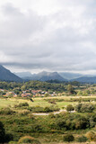 Beautiful countryside of Asturias. View of a small village near to LLares city. In background 