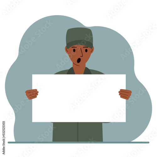 A military man in uniform holds a white sheet of paper in his hands. Concept for advertising, poster, banner.