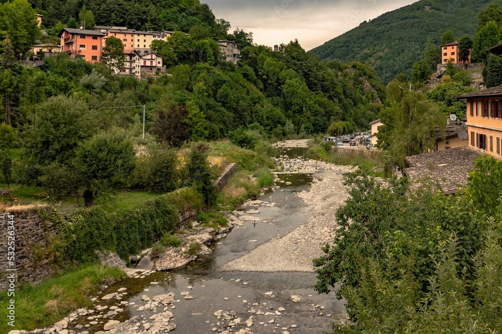 Mountain village with river and vegetation