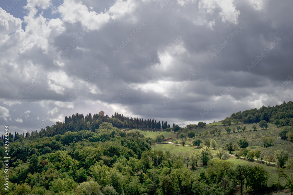 Tuscan country side under a cloudy sky