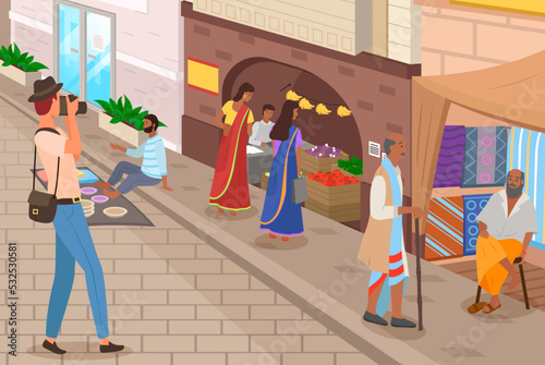 Ordinary citizens, tourists and photographer at authentic marketplace, indian market with people and different shops with ancient cityscape at background. Fabrics, carteps, spices, sweets, vegetables