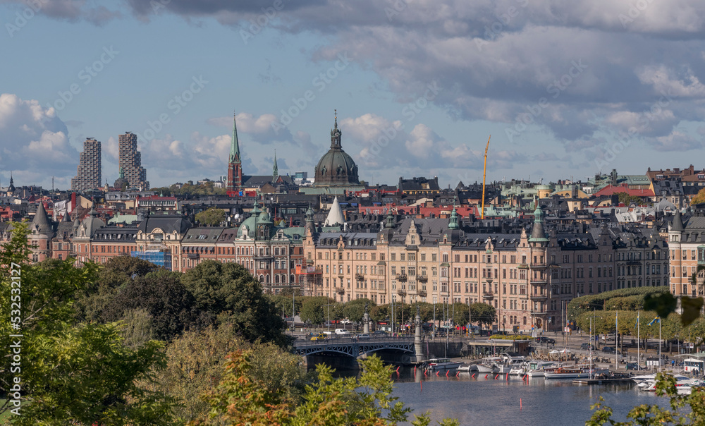 Roofs, dorms, tin facades of churches and apartment buildings in the districts Östermalm and Vasastan a sunny autumn day in Stockholm