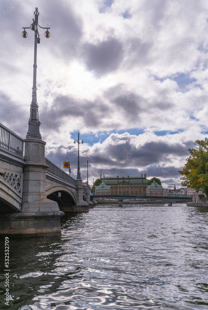 The bridge Vasabron at the stream Norrström with troubled water a cloudy autumn day in Stockholm 
