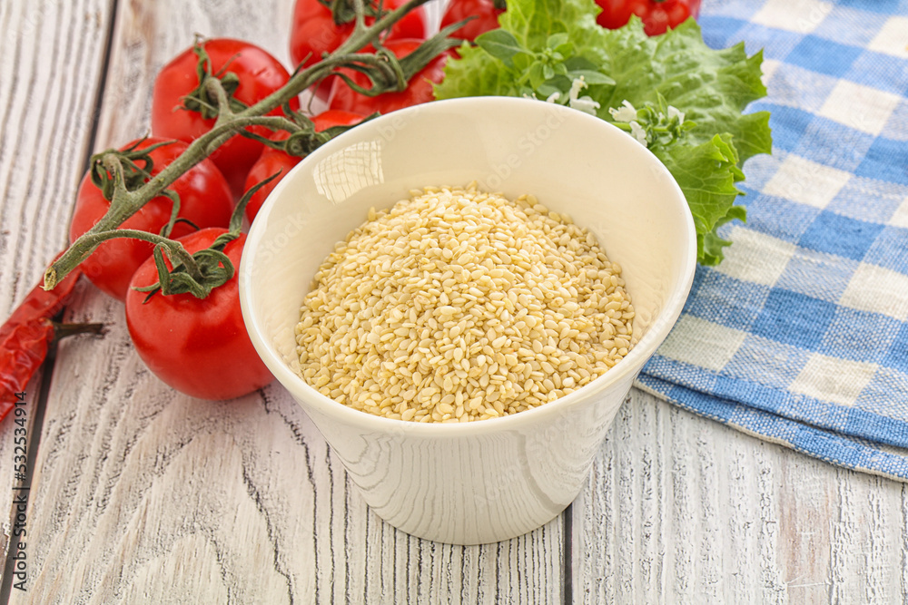 Raw sesame seeds in the bowl Raw sesame seeds in the bowl
