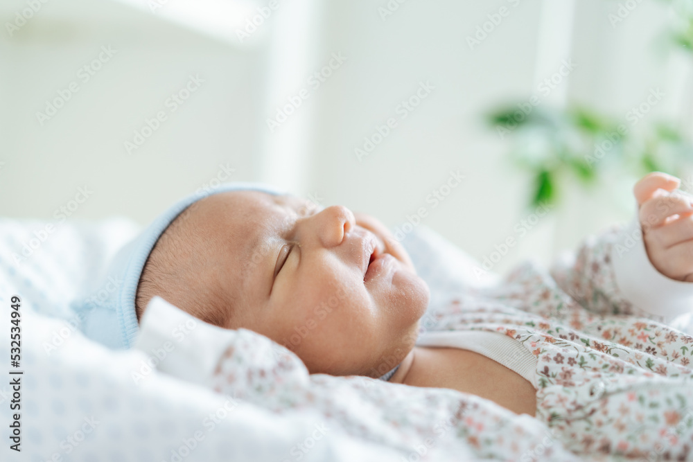 Newborn baby in his bed at home Newborn baby in his bed at home