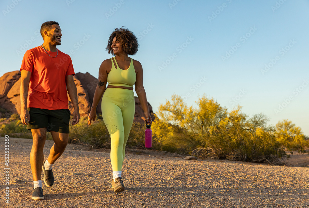 Two African American friends hiking in desert Arizona Two African American friends hiking in desert Arizona
