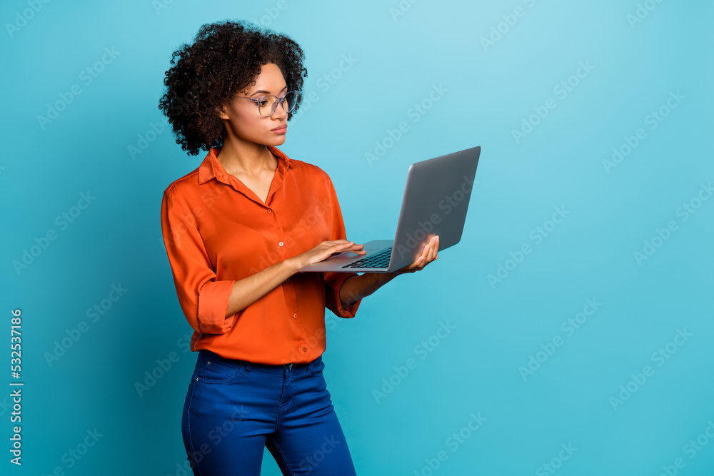Portrait of beautiful trendy wavy-haired girl using laptop copy space study learn isolated on vivid blue color background Portrait of beautiful trendy wavy-haired girl using laptop copy space study learn isolated on vivid blue color background