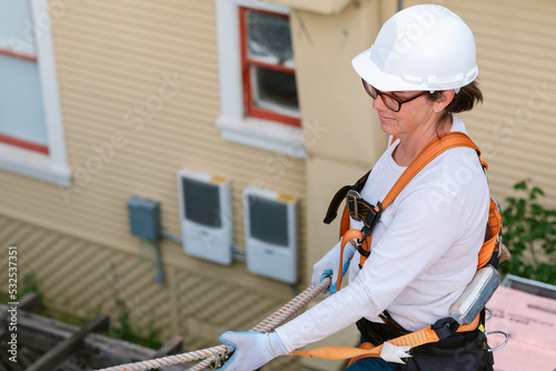 Woman roofer at working day photo