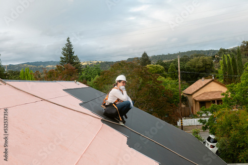 Construction woman roof installer photo