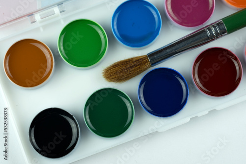 Wallpaper Mural Watercolor paints and a brush for children's creativity, isolated on a white background. Torontodigital.ca