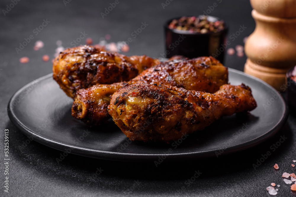 Delicious ruddy grilled chicken legs with spices and herbs