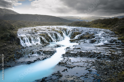 Fototapeta Naklejka Na Ścianę i Meble -  Bruarfoss view. Awesome waterfall in Iceland with blue water river.