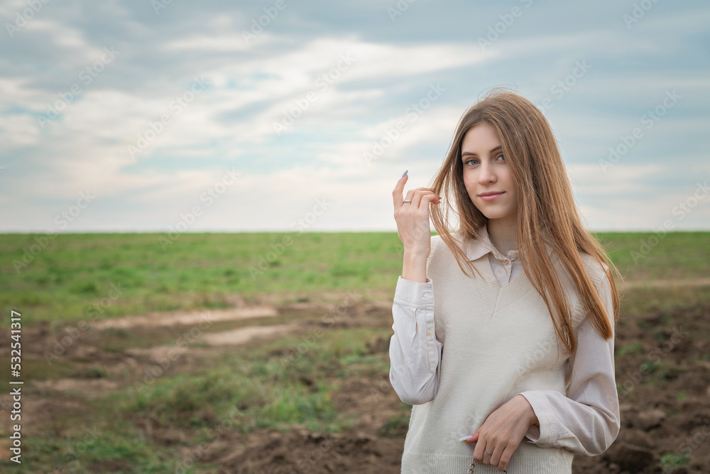Portrait of a young beautiful fair-haired girl in the autumn park. Portrait of a young beautiful fair-haired girl in the autumn park.