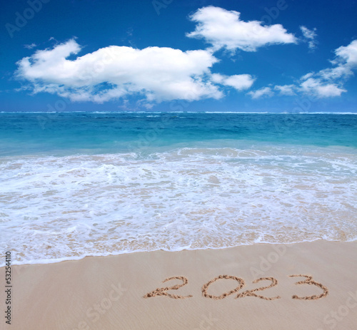 New Year 2023 is coming concept on tropical beach.
