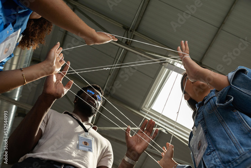Business staff activity with entwined rope photo