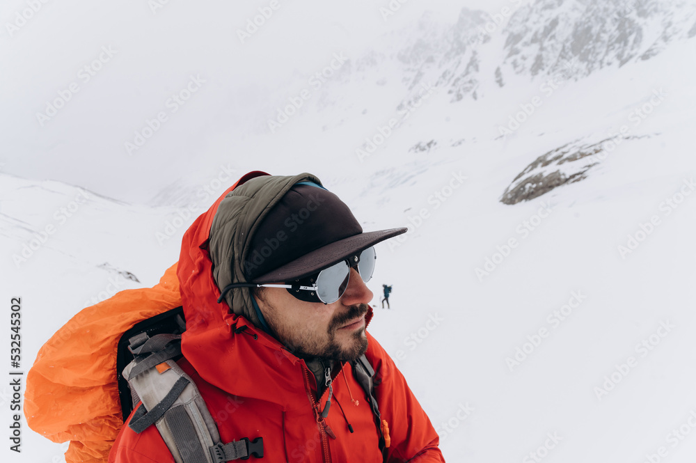 Man on slope of snowy mountain Man on slope of snowy mountain