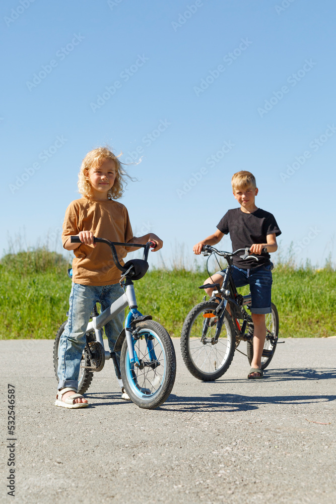 Kids on bicycles in countryside