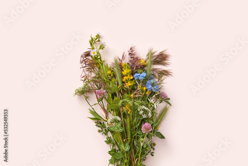 Bouquet of fresh wildflowers and herbs. photo