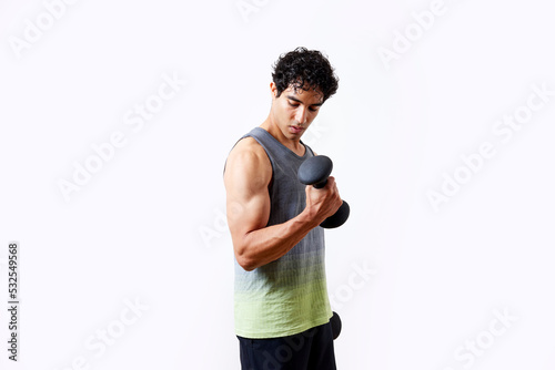 Hispanic man doing bicep curl exercise with dumbbell