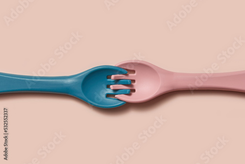 Two silicone kid forks connected with tines photo