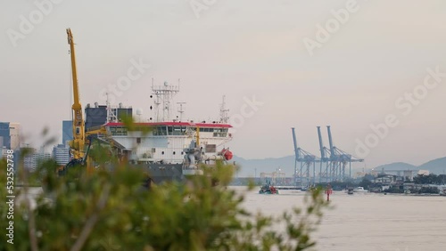 Dredge leaving river towards the sea at sunrise, Itajaí - Santa Catarina