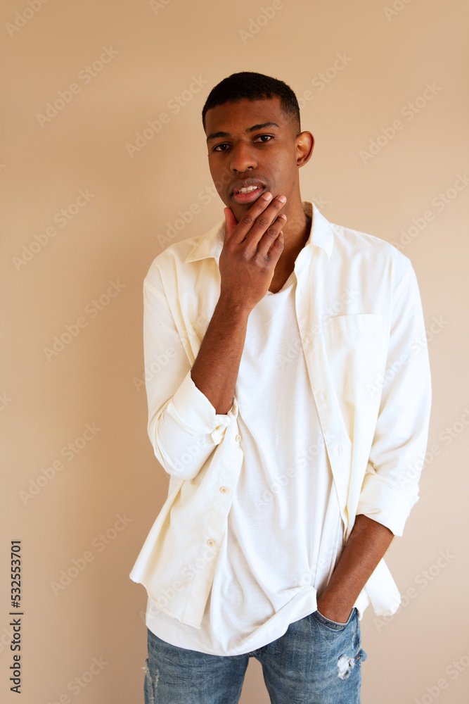 Tall man touching his chin, gesture Tall man touching his chin, gesture