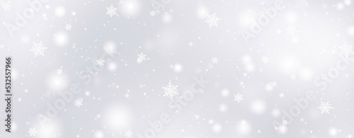 Decorative christmas background with bokeh lights and snowflakes