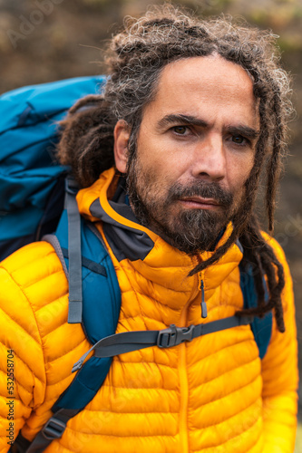Adult montaineer with gray hair and dreadlocks
 photo