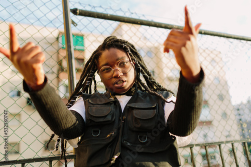 Androgynous young girl rapping photo