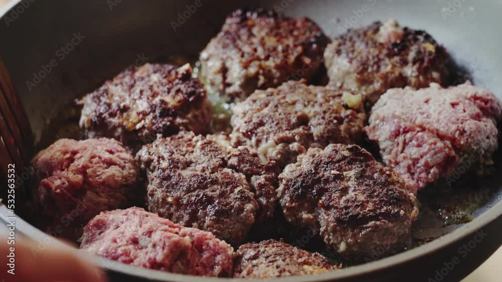 Frying meatballs cutlets in oil On a frying pan unhealthy food Slow motion video