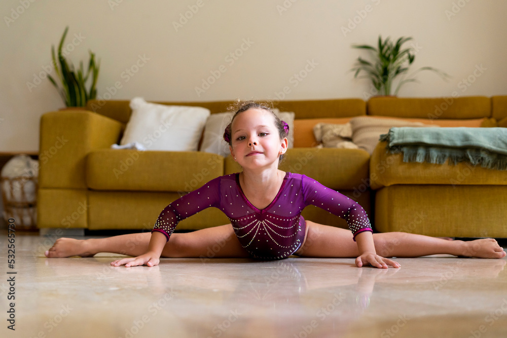 little girl practicing artistic gymnastics at home little girl practicing artistic gymnastics at home