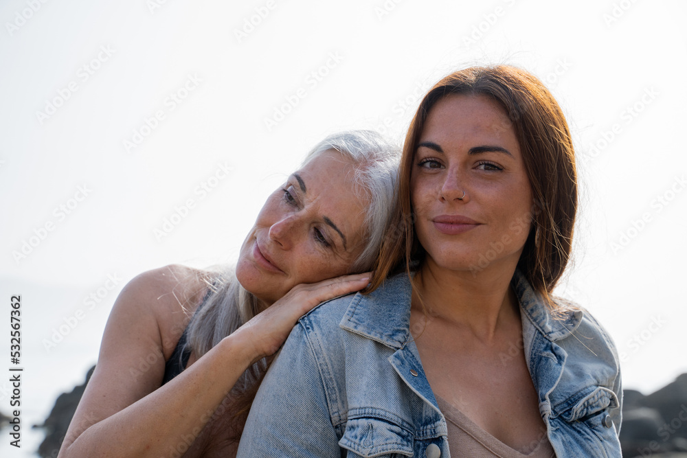 © Alba Vitta/Stocksy - Mother and daughter at beach on holidays