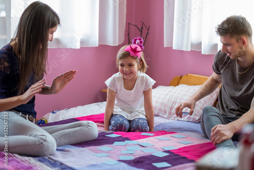 The family is playing a card game