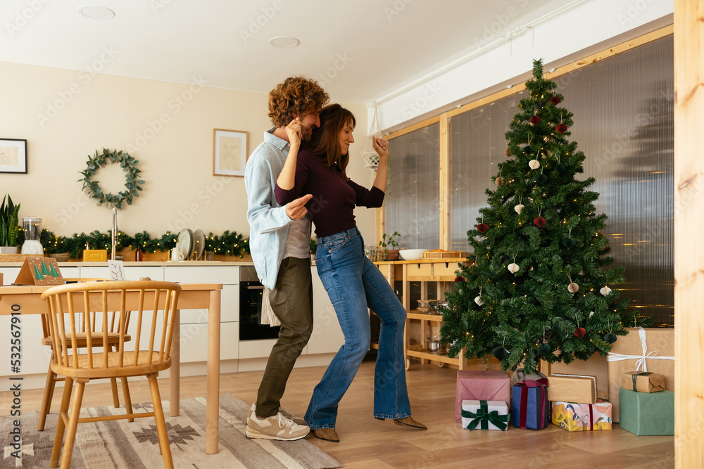 Couple snapping fingers and dancing on Christmas day Couple snapping fingers and dancing on Christmas day