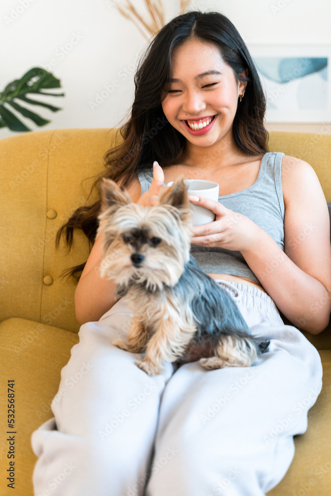 Woman relaxing with her dog at home. Woman relaxing with her dog at home.
