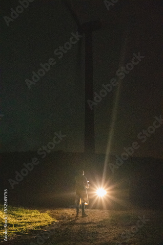 Alien in front of a car at night photo