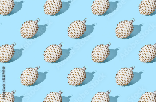 Pattern of christmas balls on blue pastel background
