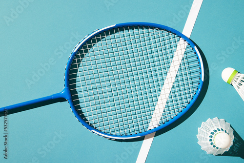 Badminton racket and shuttlecocks prepared for game photo