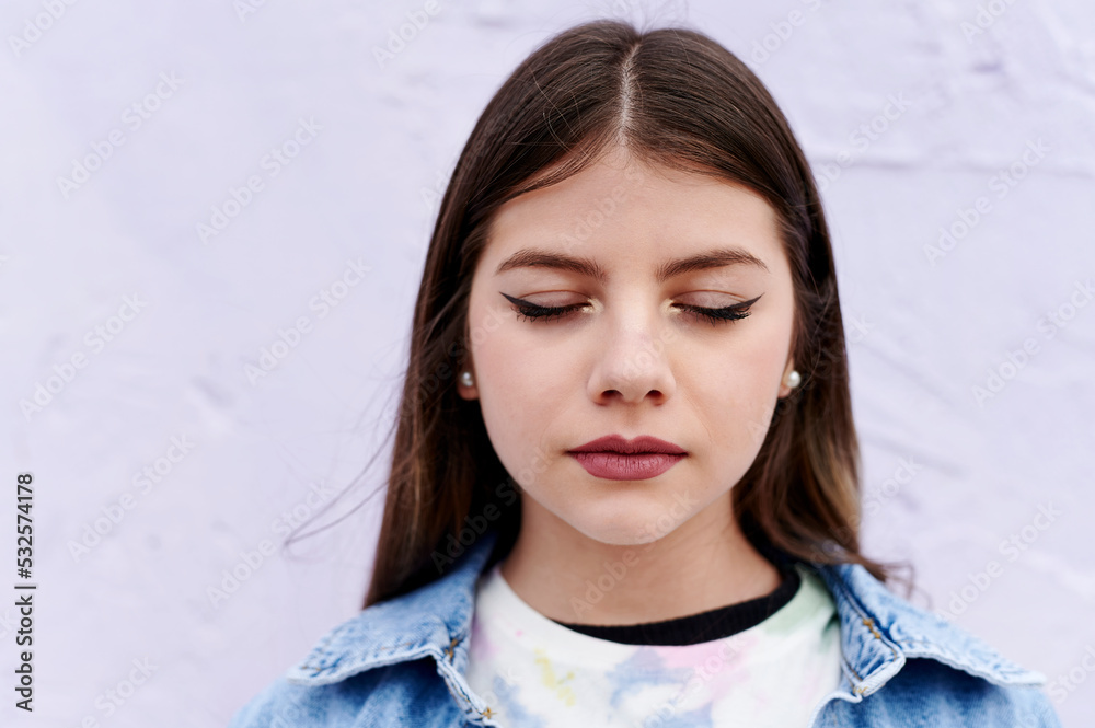 Teen girl standing with her eyes closed outside Teen girl standing with her eyes closed outside