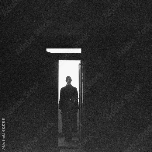 Silhouette of a woman in the hallway.