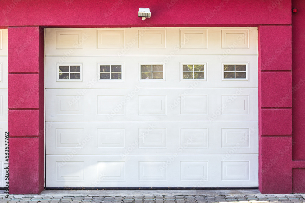 Fototapeta premium Red facade of home with home garage