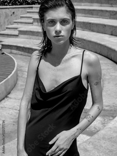Stylish portrait of a girl in a black dress